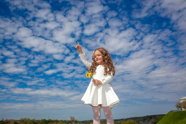 Little girl in the clouds — Stock Photo, Image