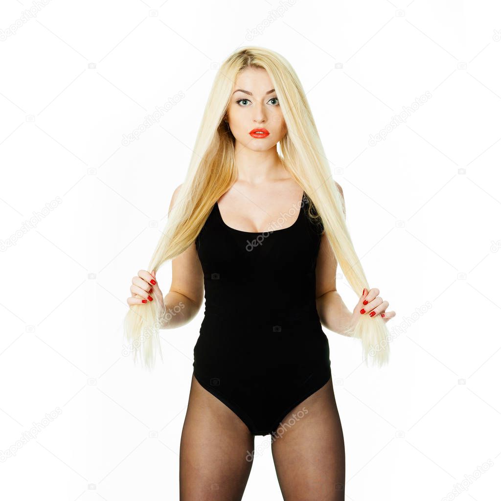 Erotic blonde girl in bodysuit on a white background