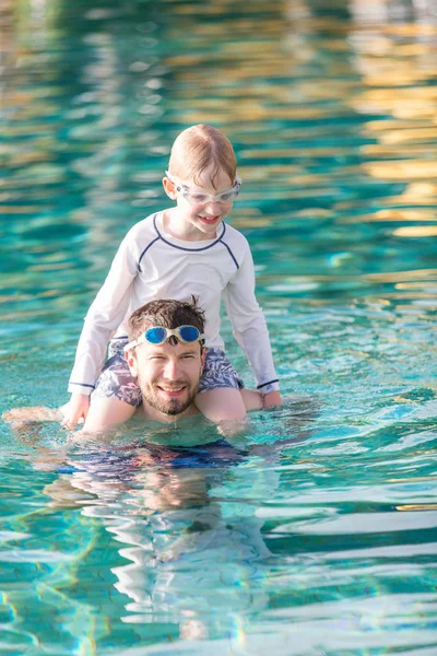 Family in the pool — Stock Photo, Image