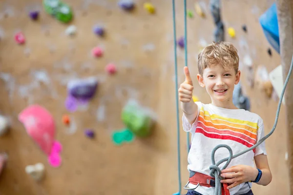 Boy at rock climbing gym — 스톡 사진