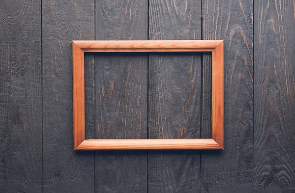 Frame on wooden background — Stock Photo, Image