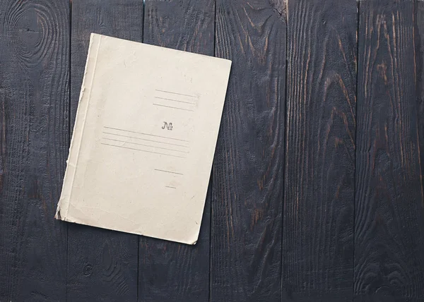 Old folder on wooden background — Stock Photo, Image