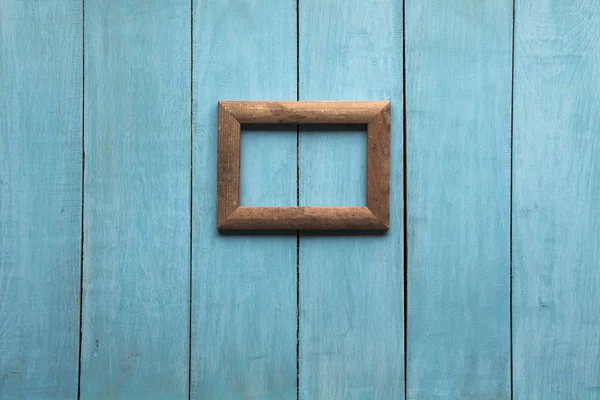 Frame on wooden wall — Stock Photo, Image