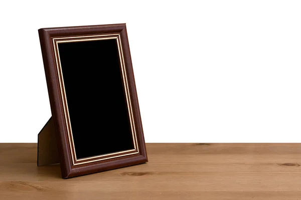 Photo frame on table — Stock Photo, Image