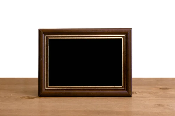 Photo frame on table — Stock Photo, Image