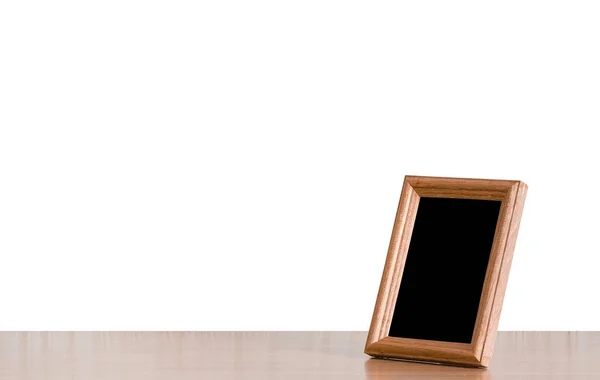 Photo frame on table — Stock Photo, Image