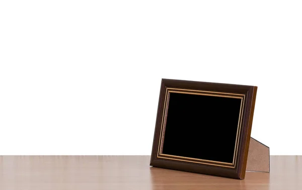 Photo frame on table — Stock Photo, Image