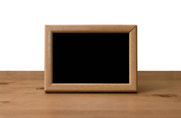 Photo frame on table — Stock Photo, Image