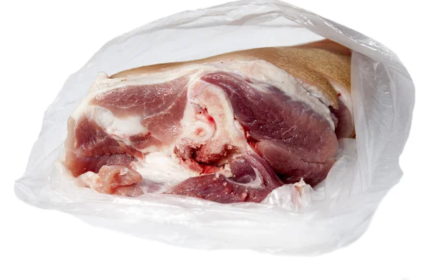 Piece of meat in a cellophane package — Stock Photo, Image