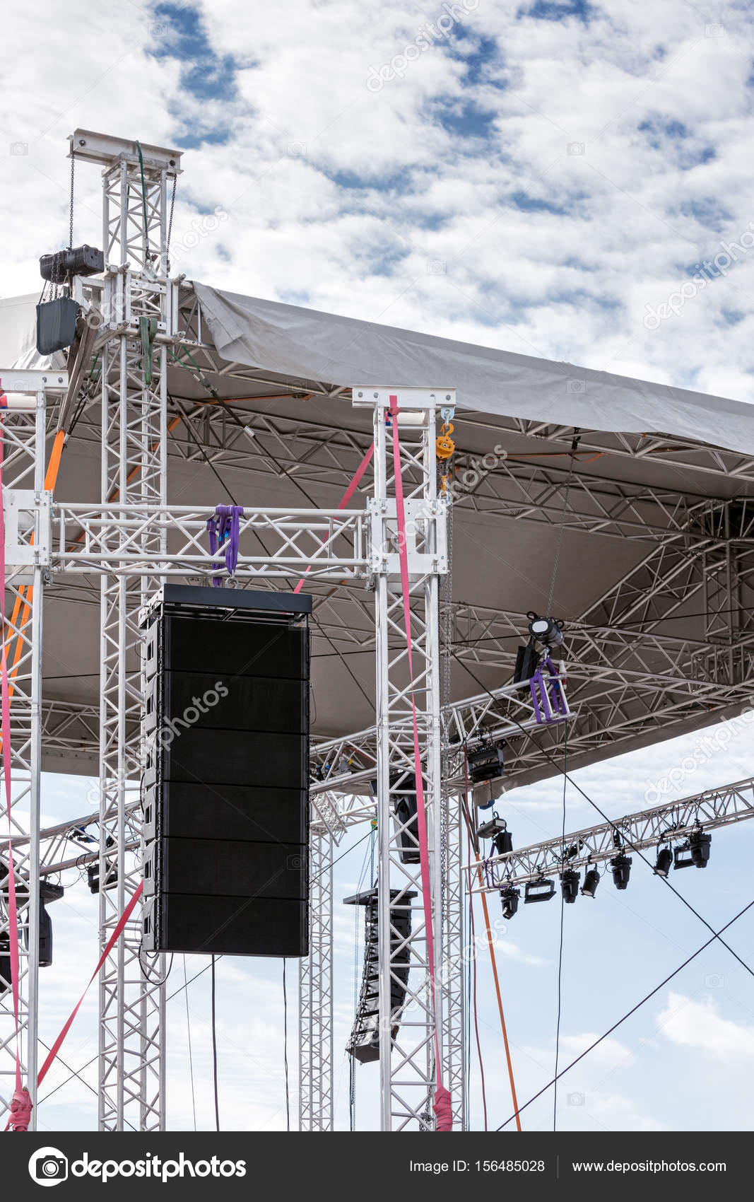 Spotlights And Sound System Mounted Under Roof Of Outdoor Stage