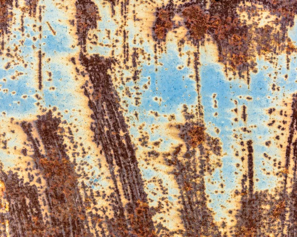 old metallic surface with rusty spots and chipped paint