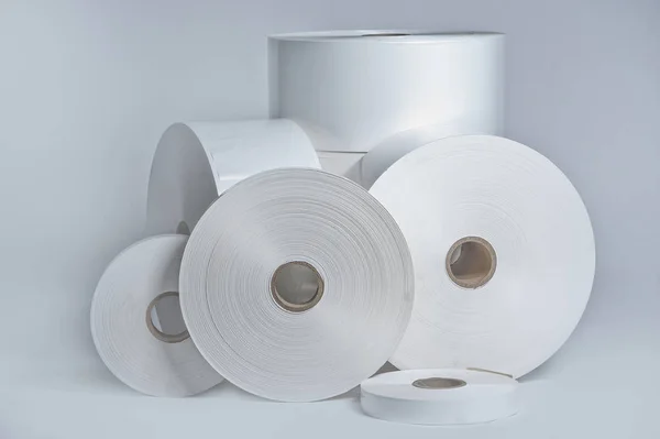 Rolls of wrapping plastic stretch film on white background — Stock Photo, Image