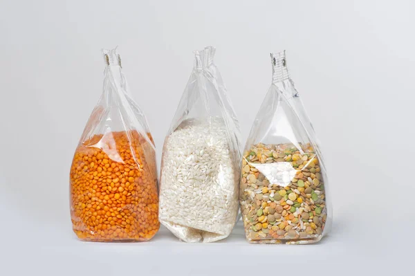 Cereal in plastic bags on a white background — Stock Photo, Image