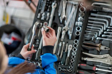 Keys for car repair in a car workshop clipart