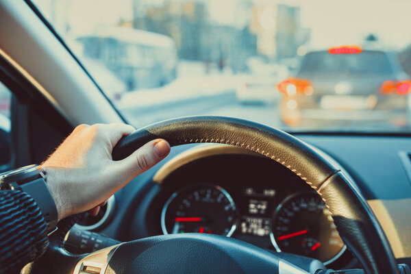 Car steering wheel with male hand