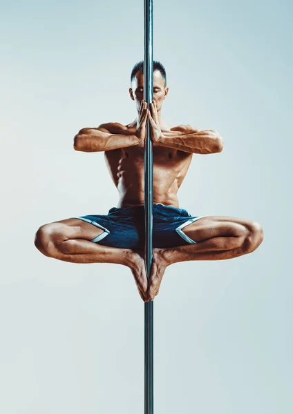 Pole dancing man — Stock Photo, Image