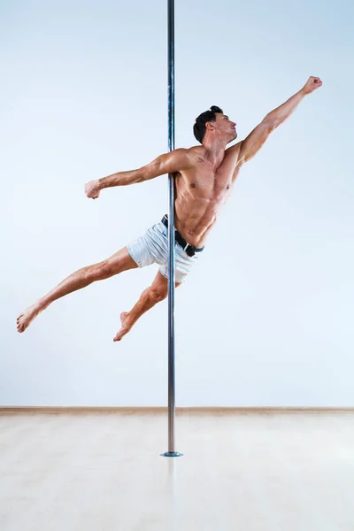 Pole dancing man — Stock Photo, Image