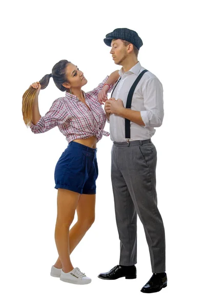 Young man in a cap and woman in shorts — Stock Photo, Image