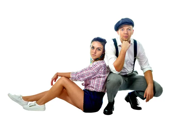 Young man in a cap and woman in shorts — Stock Photo, Image