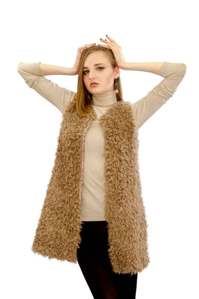 Beautiful young girl in a vest an artificial fur — Stock Photo, Image