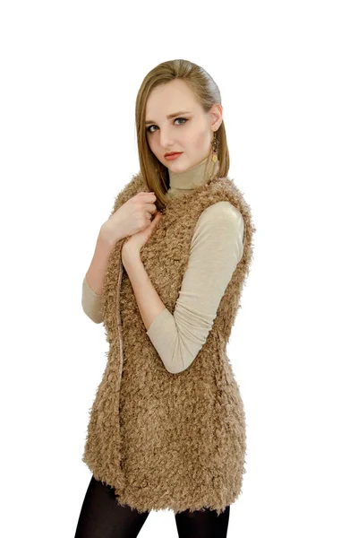 Beautiful young girl in a vest an artificial fur — Stock Photo, Image