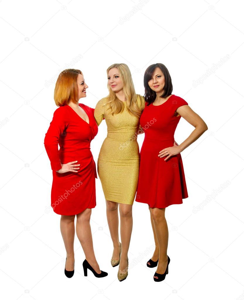 three beautiful girlfriends in elegant dresses