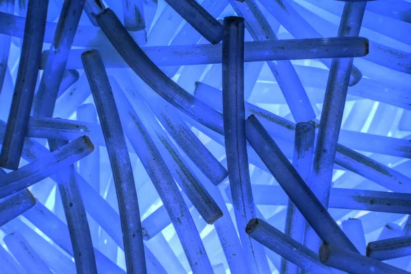 Abstract blue background of curved short sticks — Stock Photo, Image