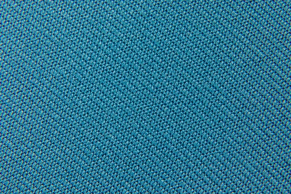 Fundo de um tecido de cor azul close-up de um entrelaçamento — Fotografia de Stock