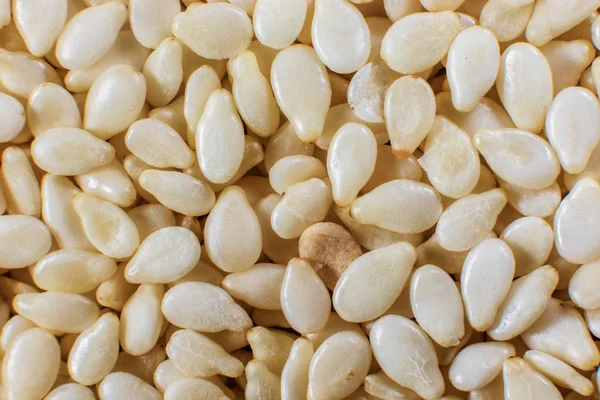 Background of small sesame seeds closeup — Stock Photo, Image