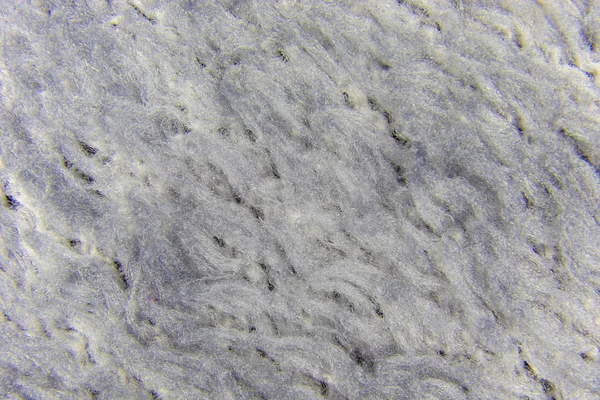 Achtergrond van grijze synthetische wol stof — Stockfoto