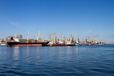  sea ships loading tower cranes in port