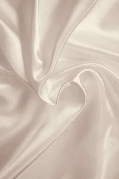 Glat elegant gylden silke eller satin som baggrund. I Sepia tone - Stock-foto