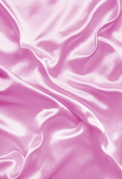 Sutra merah muda atau tekstur satin yang halus sebagai latar belakang — Stok Foto