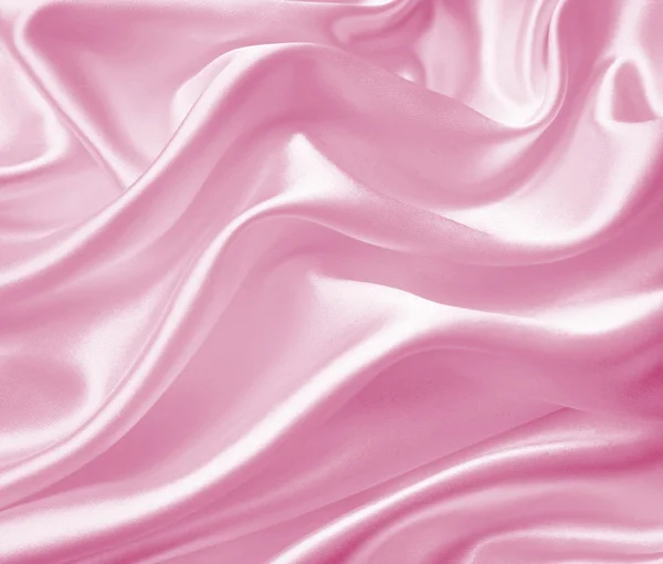 Гладкий элегантный розовый шелк или атласная текстура в качестве фона — стоковое фото