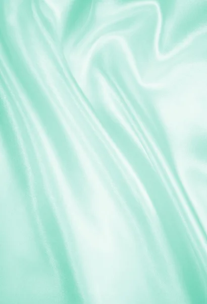 Гладкий элегантный зеленый шелк или атласная текстура в качестве фона — стоковое фото