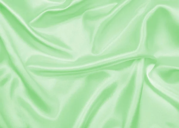 Sima, elegáns, zöld selyem vagy szatén luxus ruhával a textúra a abstr — Stock Fotó