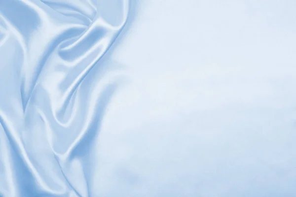 Soepele elegante blauwe zijde of Satijn luxe doek textuur als abstra — Stockfoto
