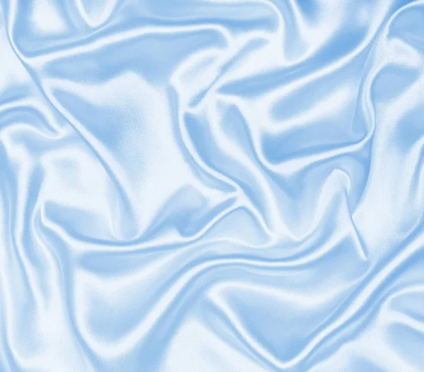 Soepele elegante blauw zijde of Satijn als achtergrond — Stockfoto