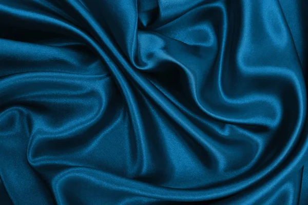 光滑的优雅蓝色丝绸或缎子豪华布料纹理作为求同 — 图库照片