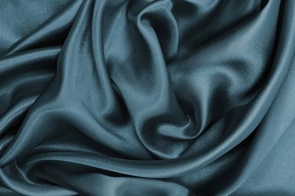 Suave elegante seda gris oscuro o textura satinada como respaldo abstracto —  Fotos de Stock