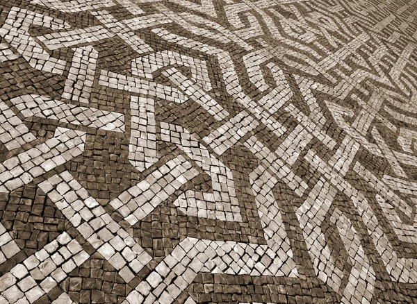 Portugal. Lisbon. Typical portuguese cobblestone pavement. In Se — Stock Photo, Image