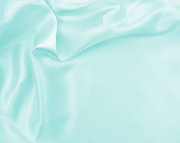 Гладкий элегантный синий шелк или атласная текстура роскошной ткани, как абстра — стоковое фото
