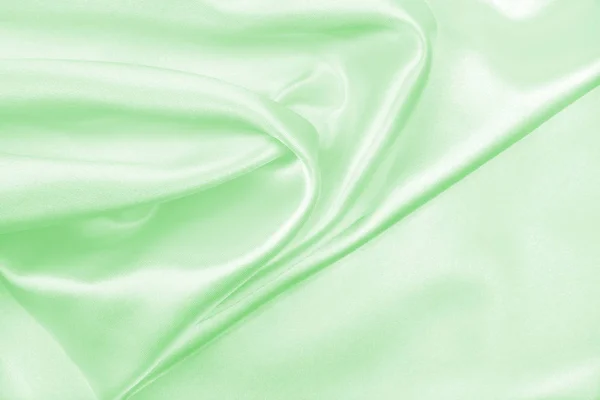 光滑优雅绿色丝绸或缎子豪华布料纹理作为二者 — 图库照片