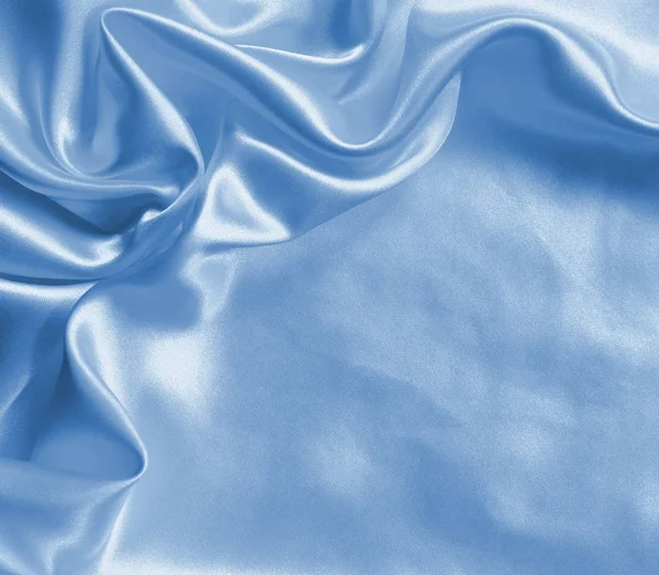 Seda azul elegante liso ou cetim como fundo — Fotografia de Stock