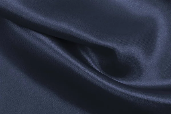 Suave elegante seda gris oscuro o textura satinada como respaldo abstracto — Foto de Stock