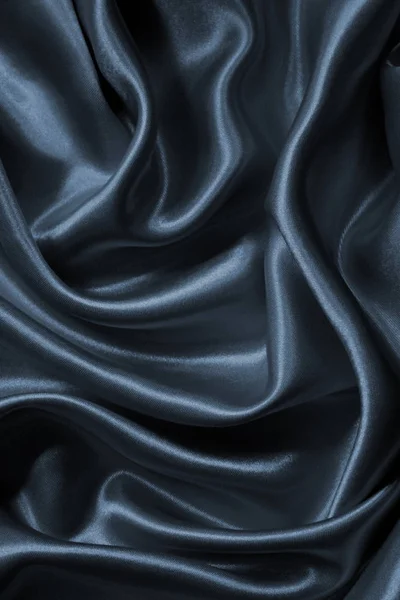 Гладкий элегантный серый шелк в качестве фона — стоковое фото