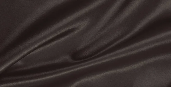 Hladká elegantní hnědé hedvábí nebo satén textury jako abstraktní poza — Stock fotografie