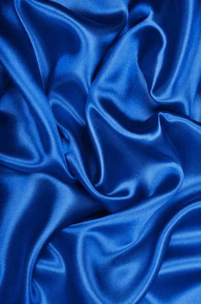 Texture lisse élégante en soie bleue ou tissu de luxe satiné comme abstra — Photo