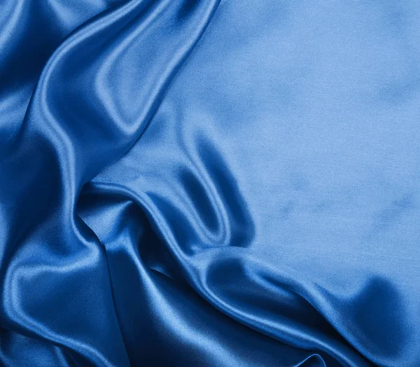 Texture lisse élégante en soie bleue ou tissu de luxe satiné comme abstra — Photo