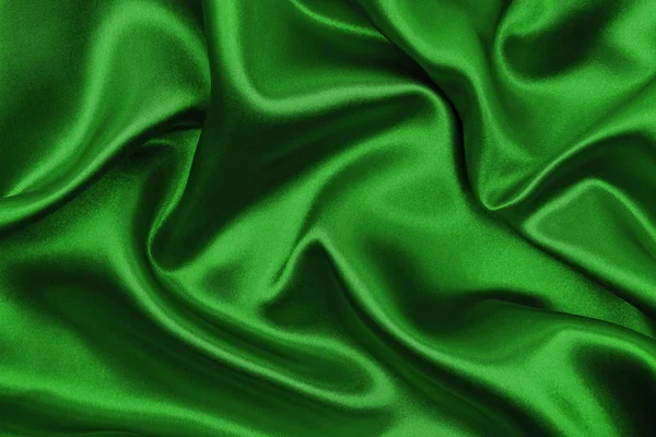 Smooth elegant green silk or satin luxury cloth texture as abstr